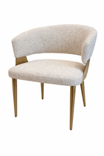 Beige upholstered chair with wooden legs on a white background