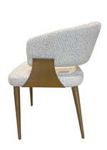 Modern chair with a textured backrest and wooden legs on a white background