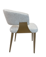 Chair with textured backrest and wooden frame on a white background