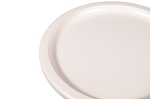 White ceramic bowl with three legs on a white background