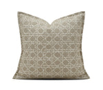 A square throw pillow with a beige and off-white geometric lattice pattern, shown against a plain white background with a brand watermark at the bottom.