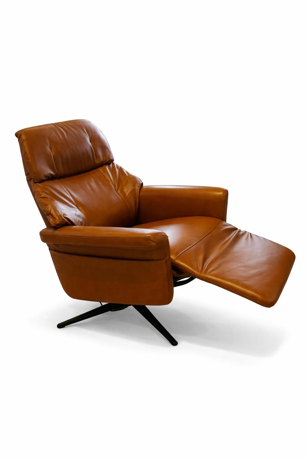 Brown leather recliner chair on a white background