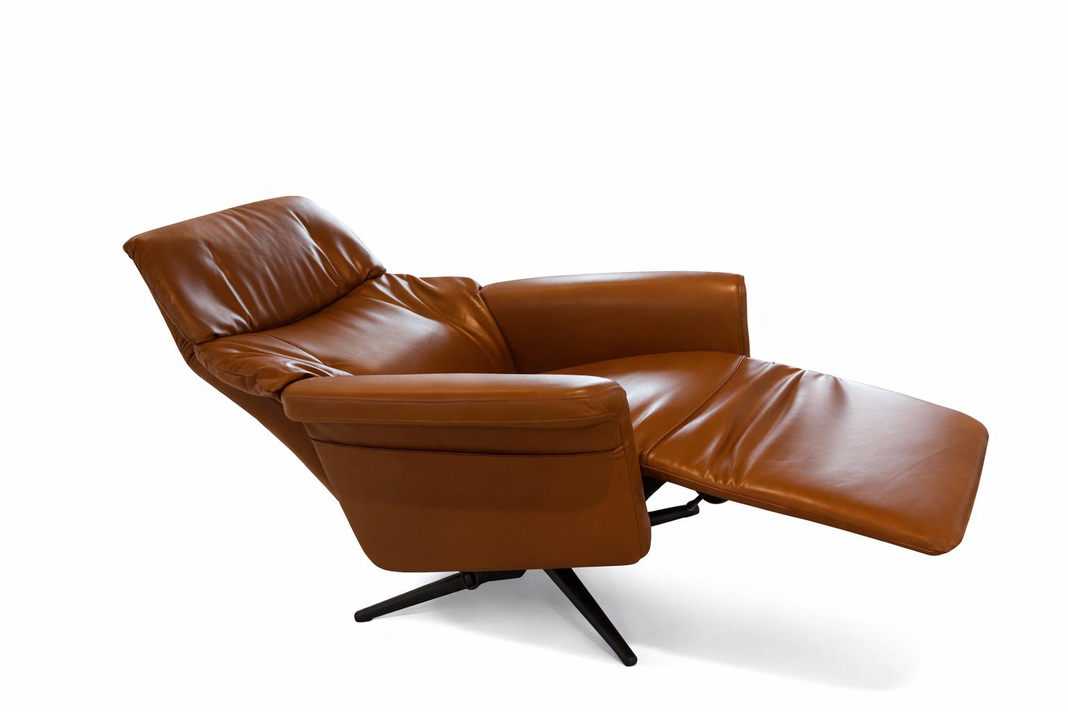 Brown leather recliner chair on a white background