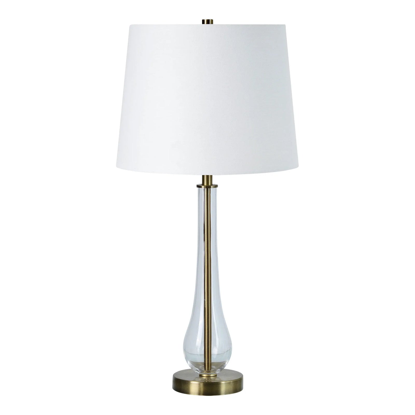 Table lamp with white shade and clear glass base on a white background