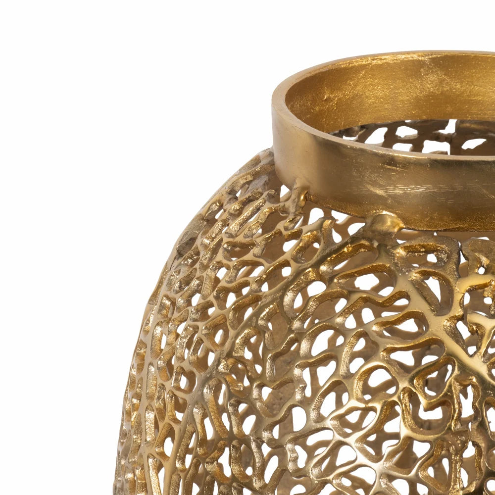 Gold decorative lantern with intricate patterns on a white background