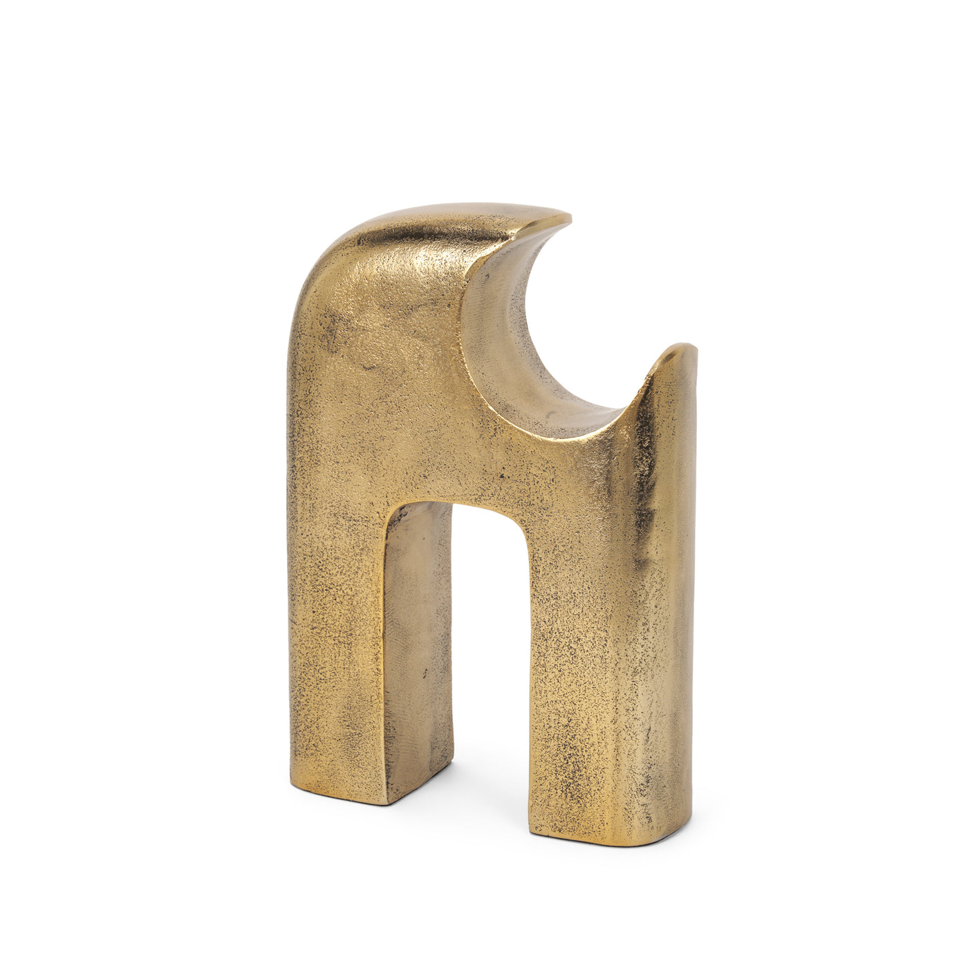 Gold metal sculpture of interlocking shapes on a white background