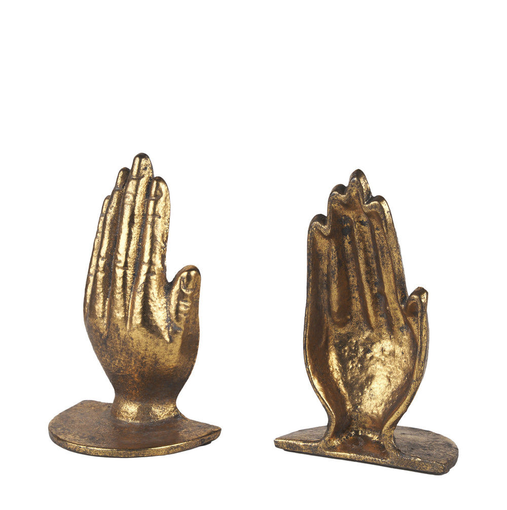 Two gold-prized hands on a white background