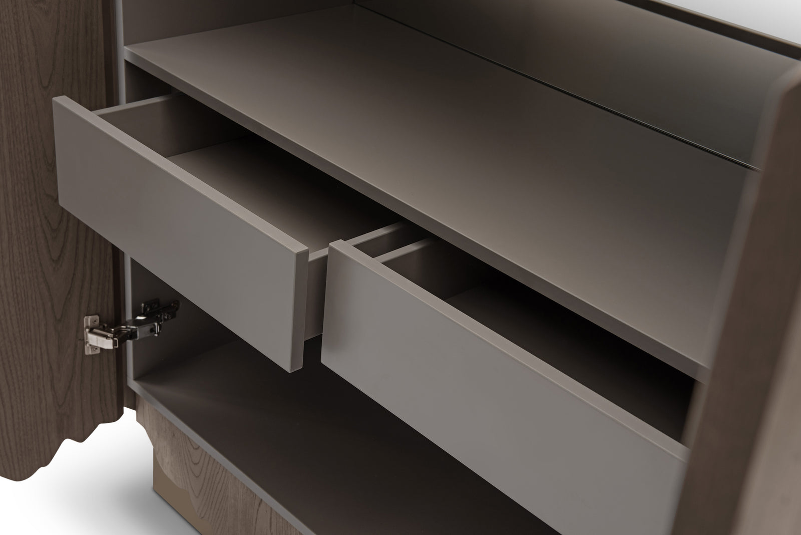 Close-up of a wooden cabinet with open drawers on a white background