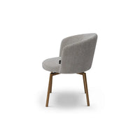 Gray upholstered chair with wooden legs on a white background