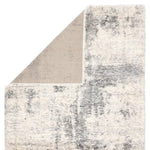 Textured area rug with a geometric pattern on a white background