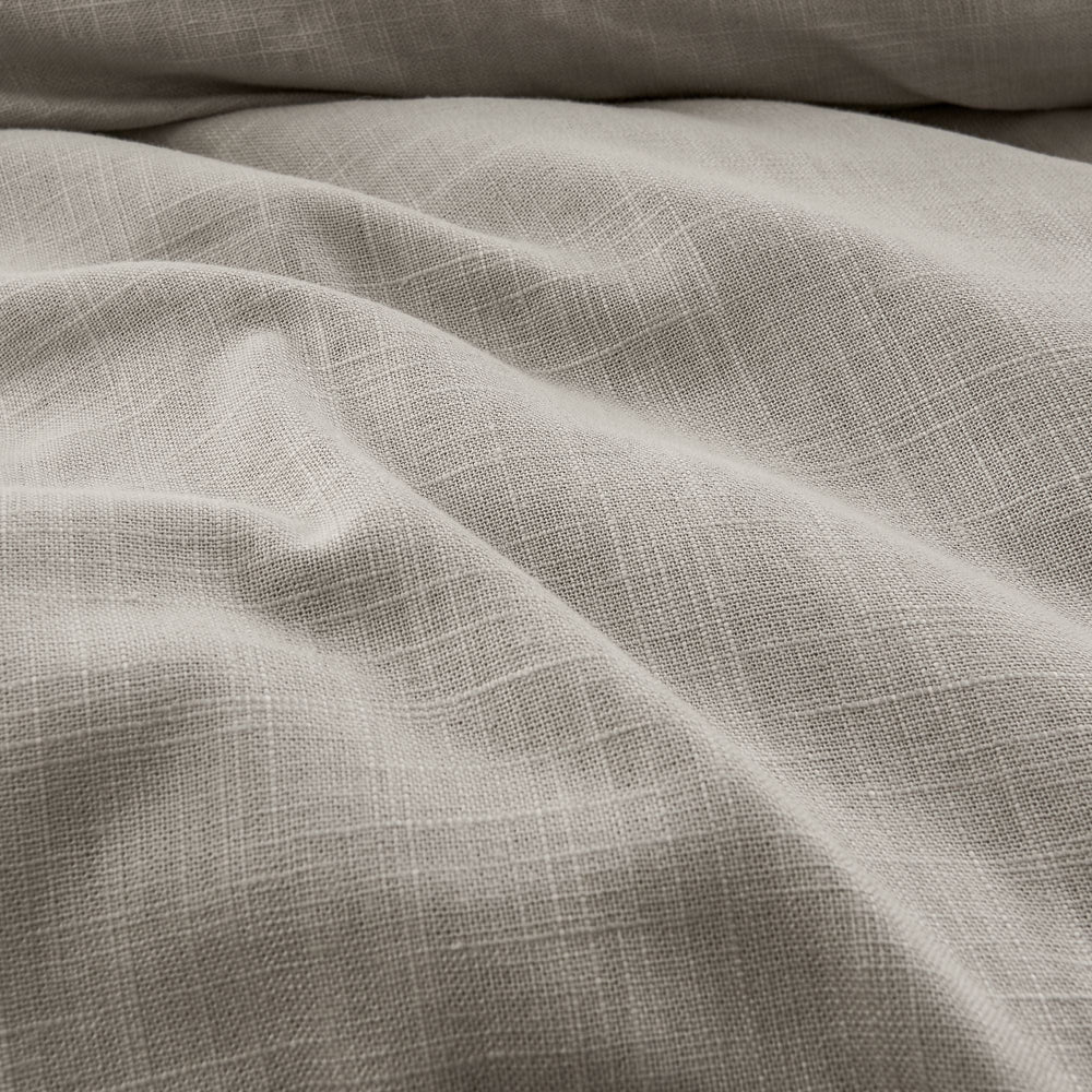 Close-up of textured gray fabric with folds