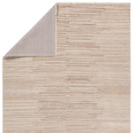 A beige area rug with a solid pattern and flat texture.