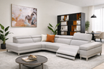 Modern living room with a gray sectional sofa, coffee table, and decorative elements.