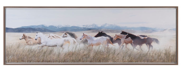 A hand-painted canvas wall art depicting a scene with horses running in an open field with mountains in the background.