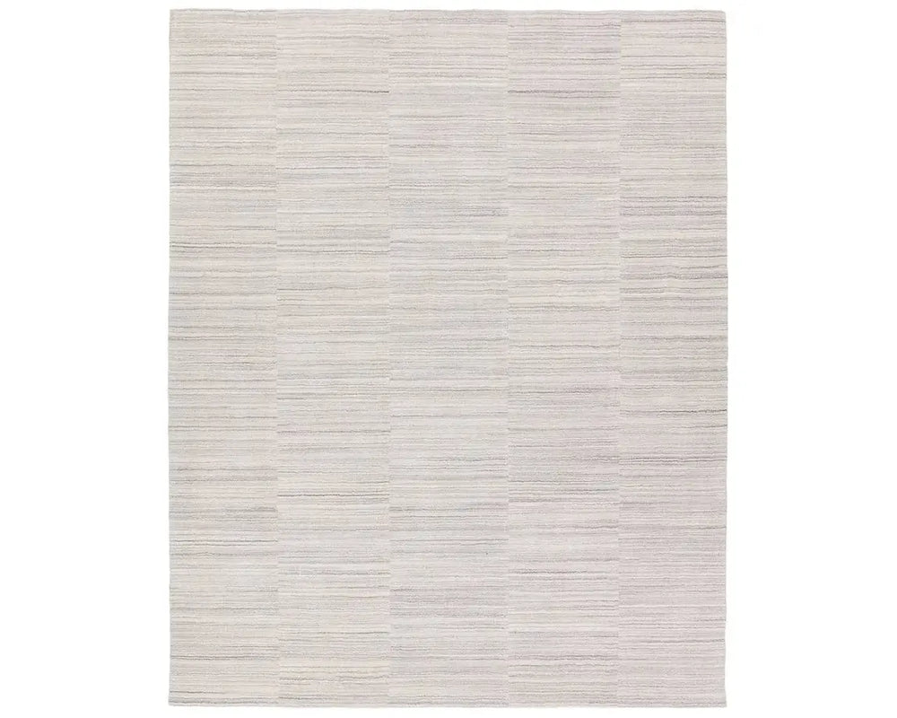 A rectangular, solid white area rug with a textured design