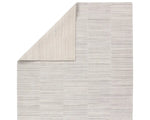 A rectangular, solid white area rug with a textured design