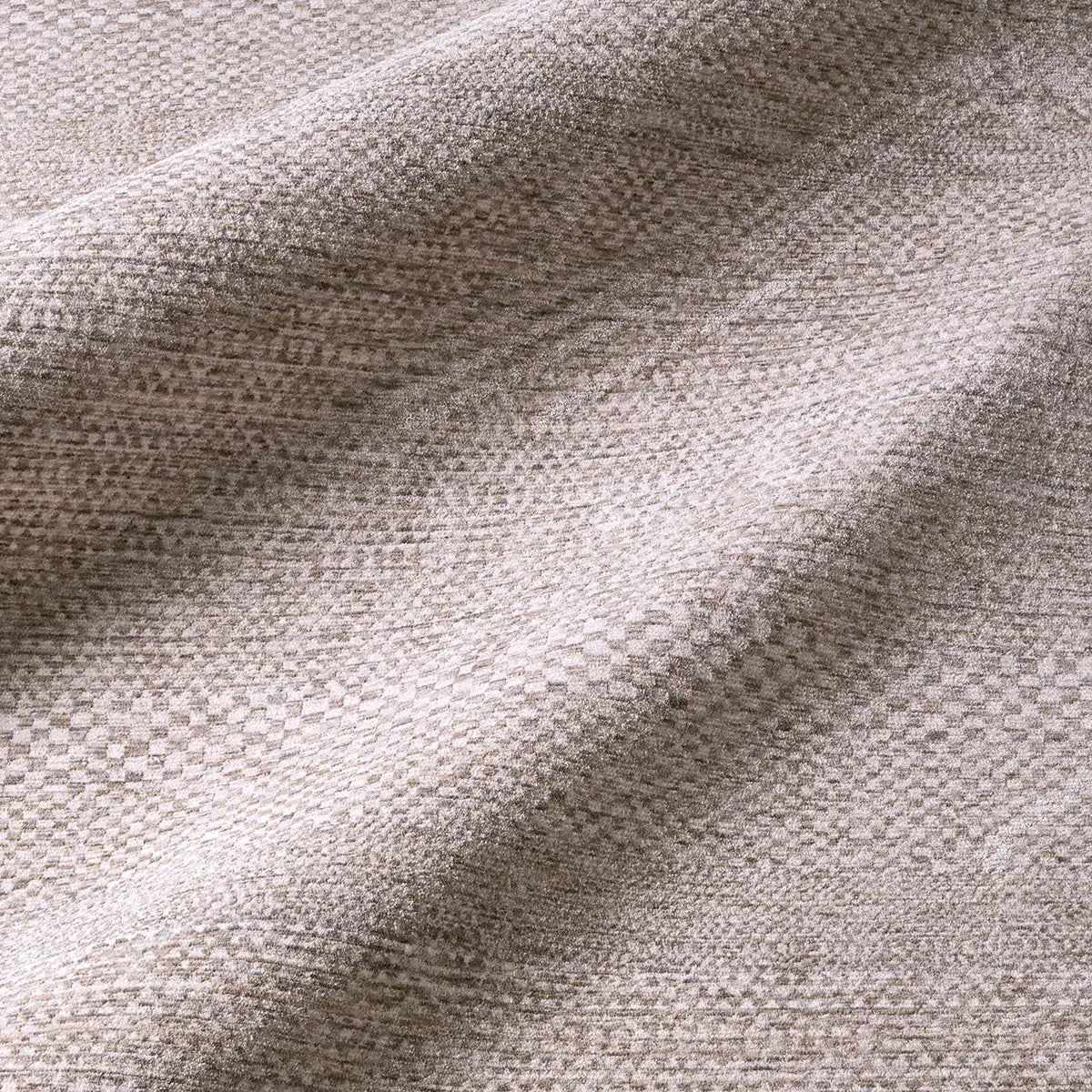 Close-up of textured gray fabric with a subtle pattern