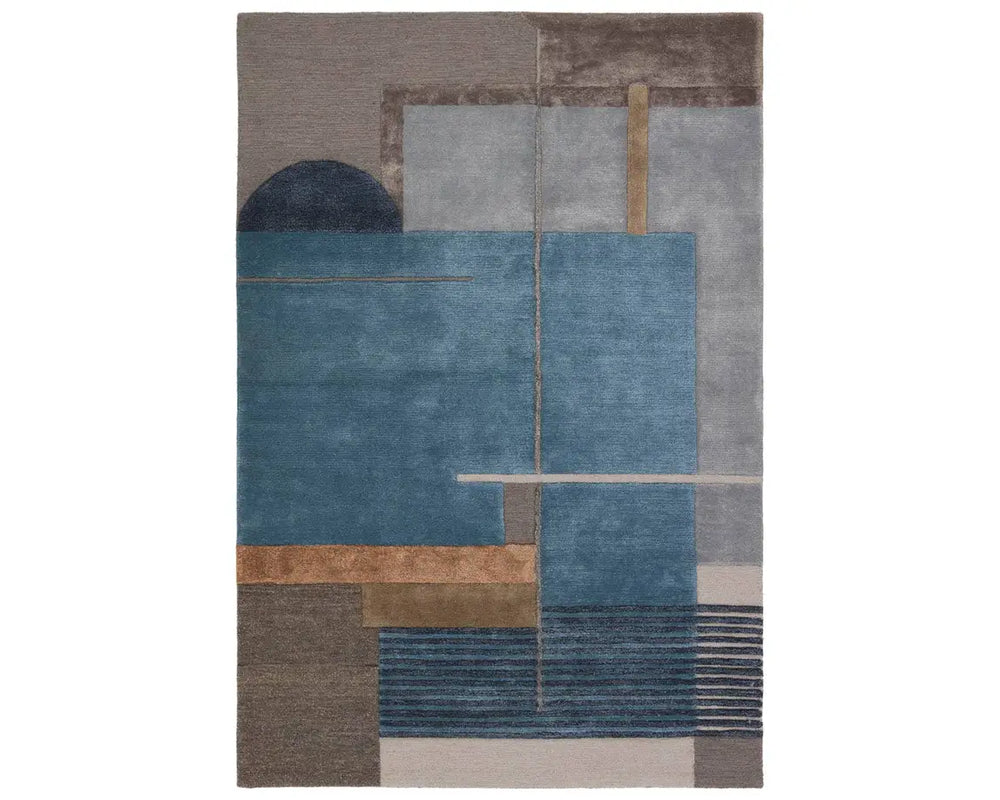 A modern geometric patterned area rug featuring shades of blue, gray, and beige.