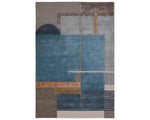 A modern geometric patterned area rug featuring shades of blue, gray, and beige.