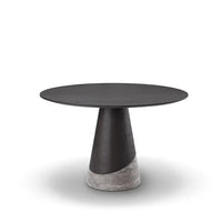 Modern black and concrete side table on a white background