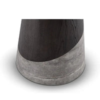Close-up of a cylindrical object with wooden top and concrete base on a white background