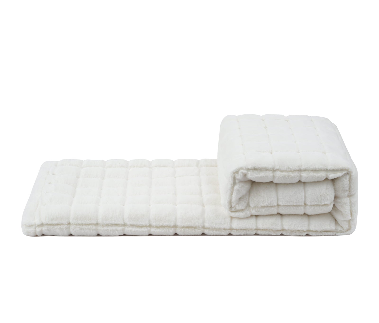 A white quilted cotton blanket, folded into a flat rectangular mat on the left and a rolled section on the right, displayed against a plain white background