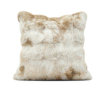 A square faux fur throw pillow in a beige and cream mottled pattern, shown against a plain white backgroundthe bottom.