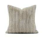A square throw pillow in a light taupe corduroy fabric, shown against a plain white background