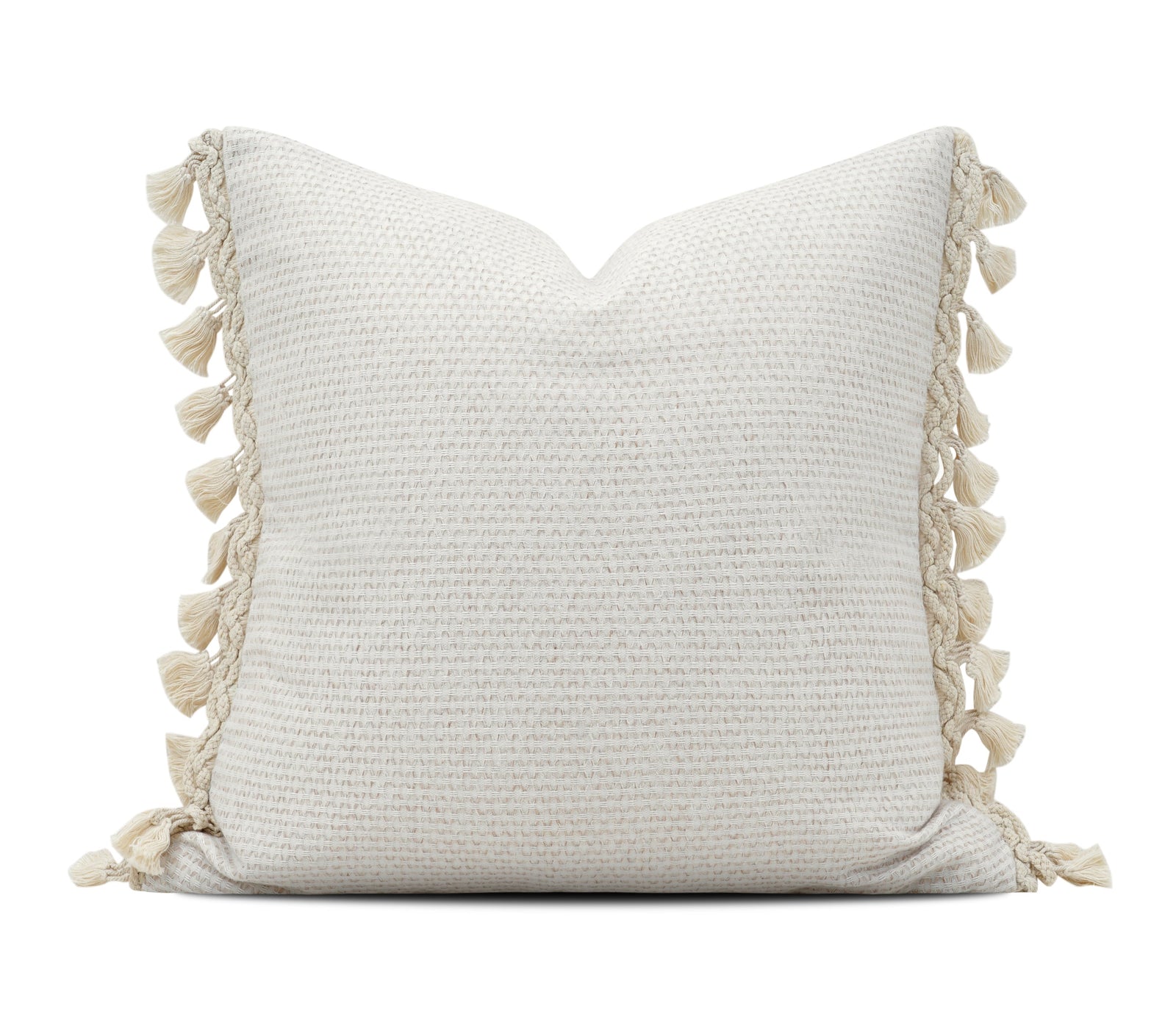 A square off-white textured throw pillow with decorative tassels on the sides, shown against a plain white background 