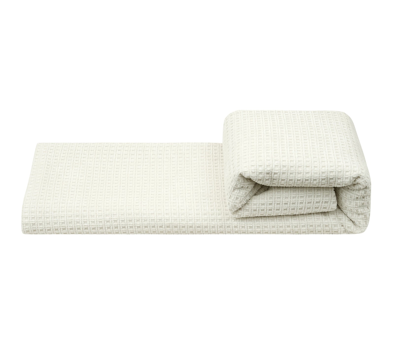 A folded off-white waffle-weave fabric, shown partially unrolled with a folded corner revealing its textured pattern, on a white background 