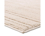 A beige and white striped area rug, power loomed with a flatweave construction.