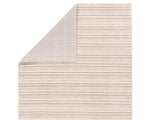 A beige and white striped area rug, power loomed with a flatweave construction.