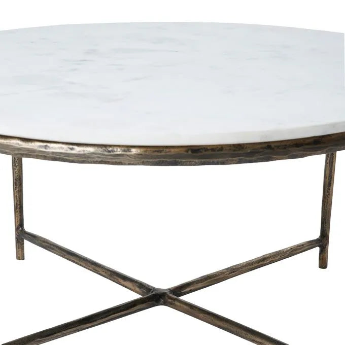 Round marble coffee table with a cast aluminum base featuring a natural white color and antique brass finish.