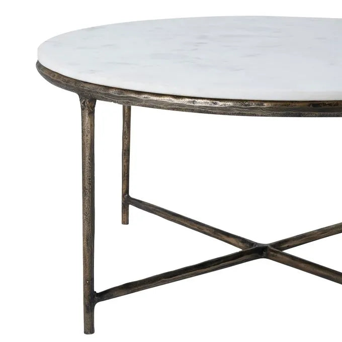 Round marble coffee table with a cast aluminum base featuring a natural white color and antique brass finish.
