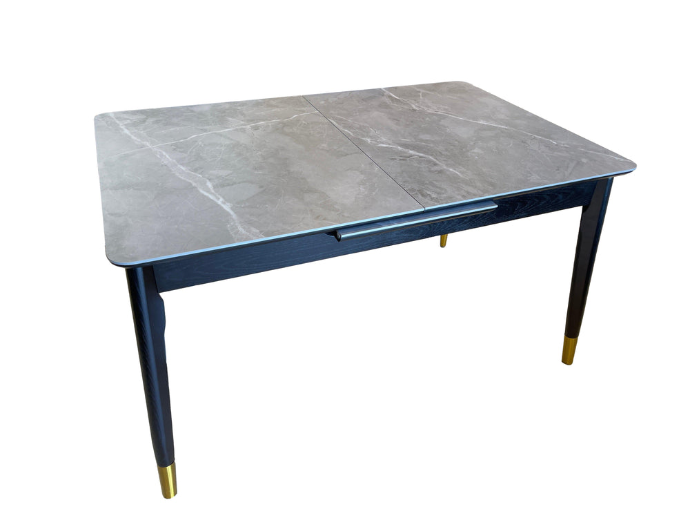 Table with a gray marble top and dark blue base on a white background