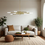 Modern living room with a white sofa, gold chandelier, and decorative items.