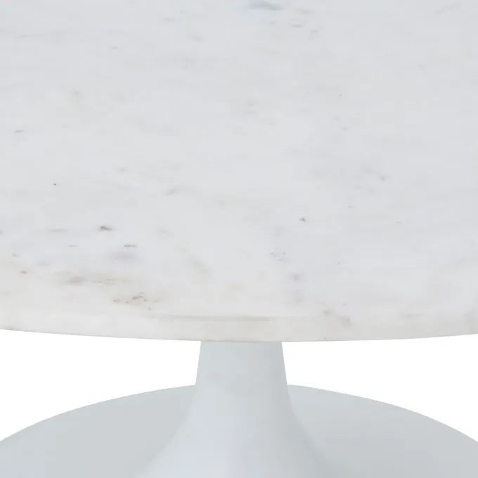 An oval marble coffee table with a white cast aluminum base and a natural white marble top.