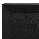 Close-up of a black speaker with textured surface