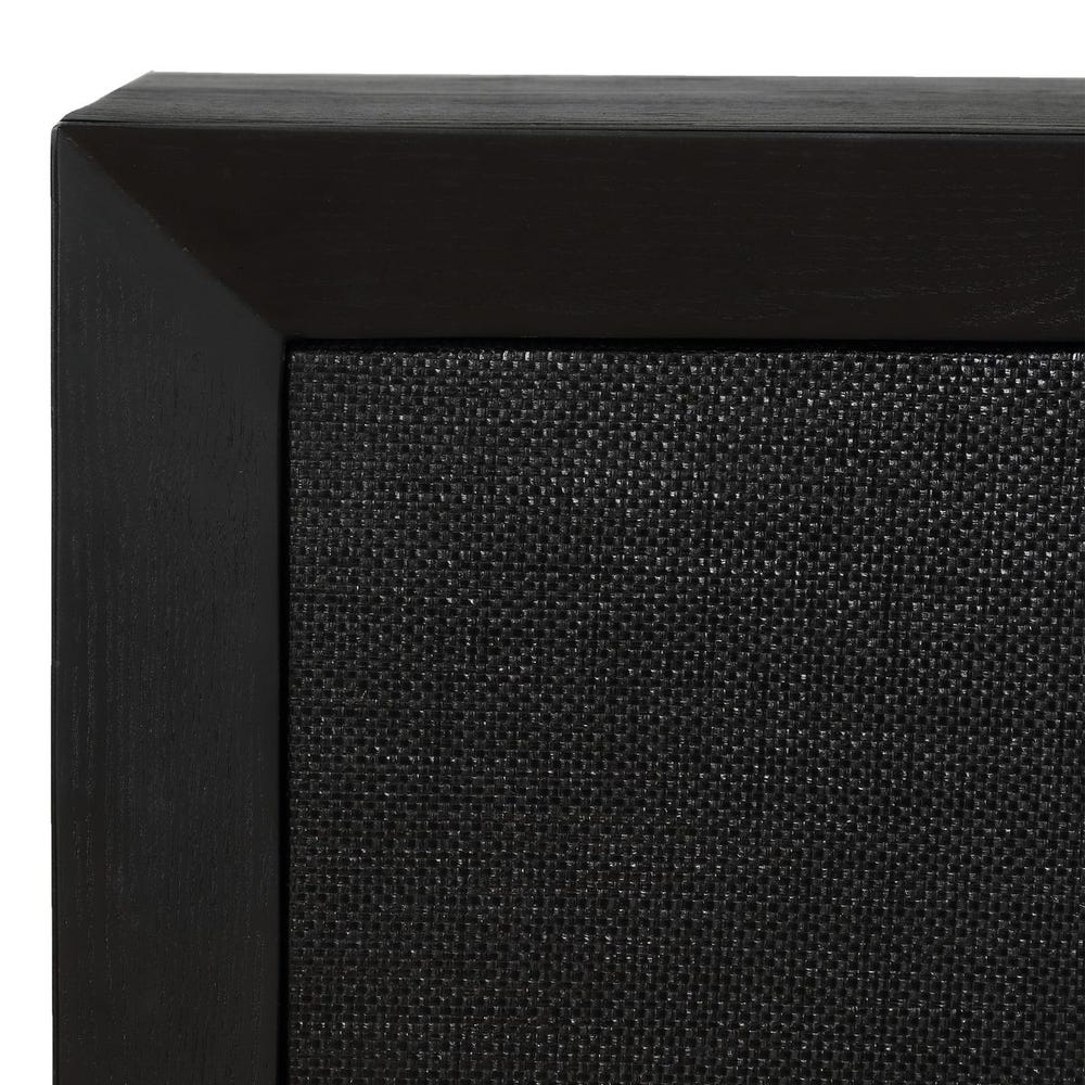 Close-up of a black speaker with textured surface