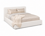A white slipcover on a bed
