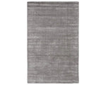 A dark gray area rug with a textured weave, handwoven from a blend of wool and viscose.