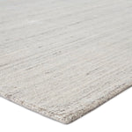 An ivory and gray area rug with a handwoven texture thickness
