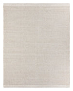 Beige rug with a subtle pattern on a white background