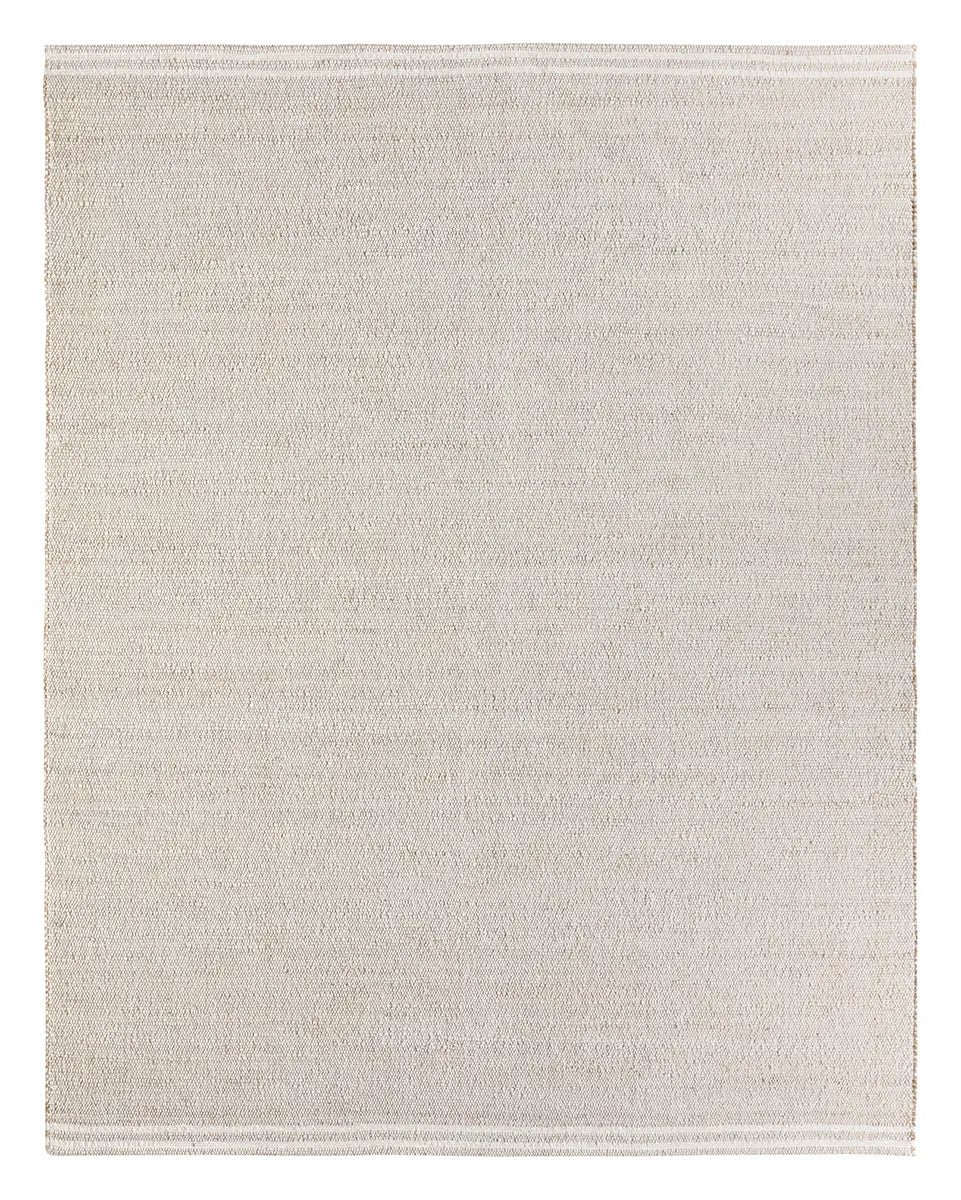 Beige rug with a subtle pattern on a white background