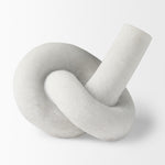 White marble knot sculpture on a white background