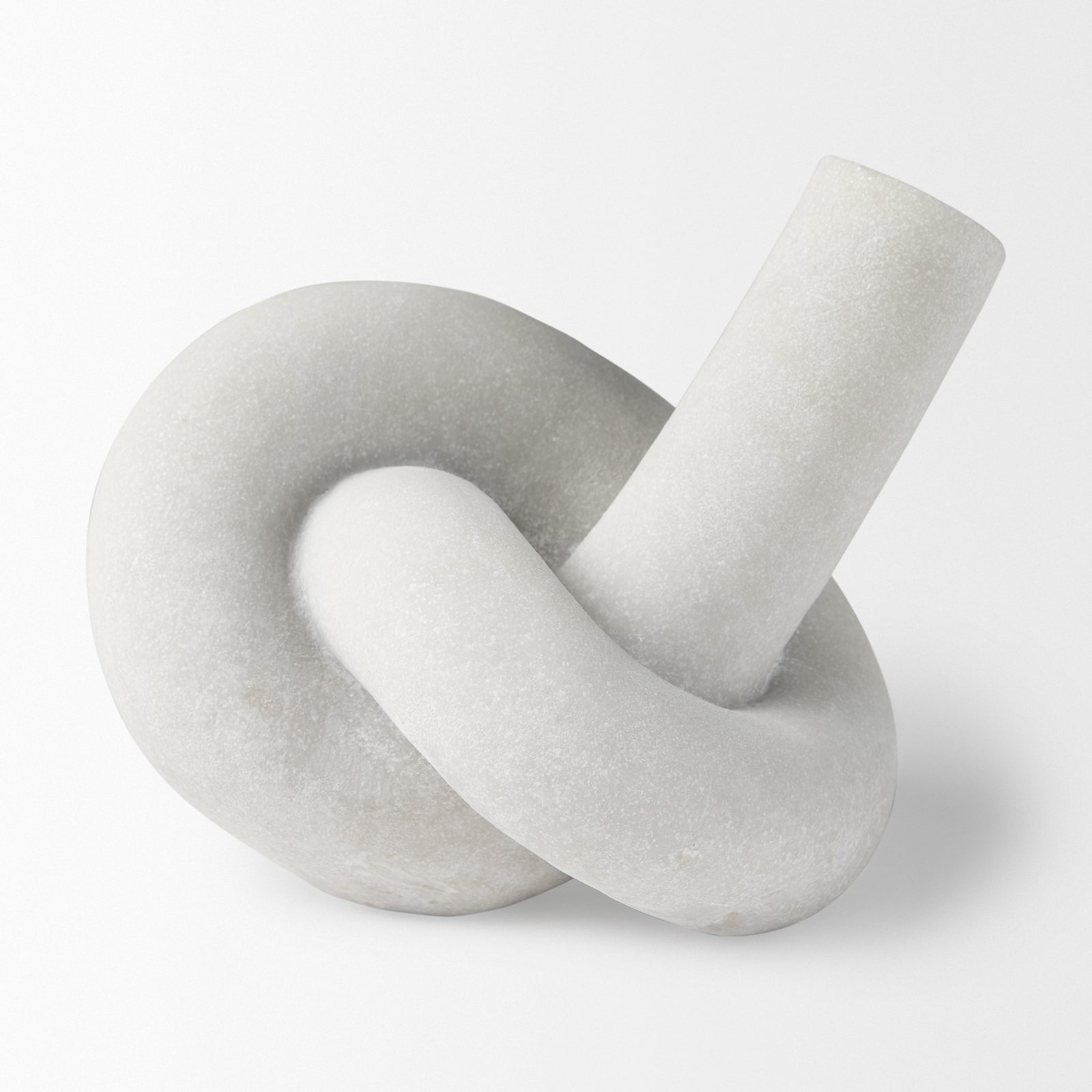 White marble knot sculpture on a white background