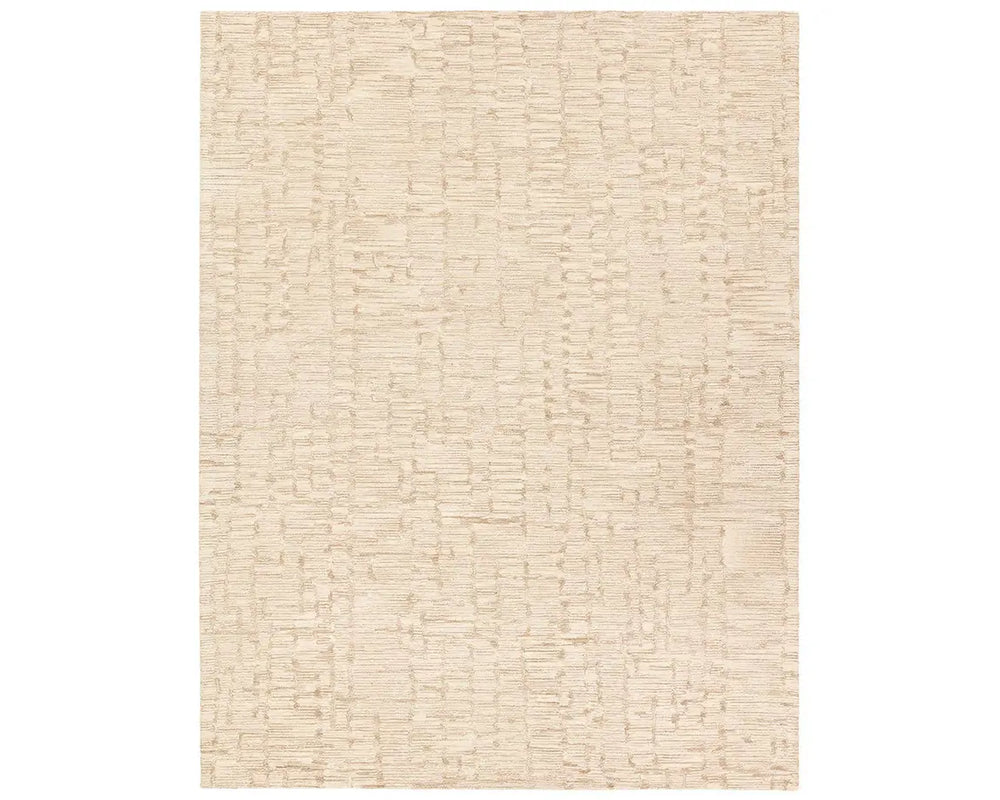 A beige wool area rug with a hand-tufted texture.