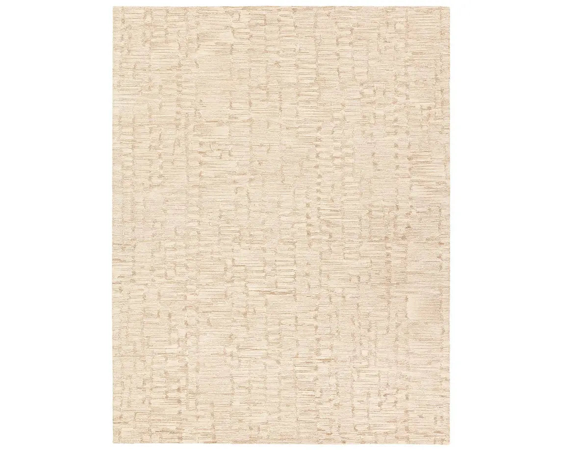 A beige wool area rug with a hand-tufted texture.