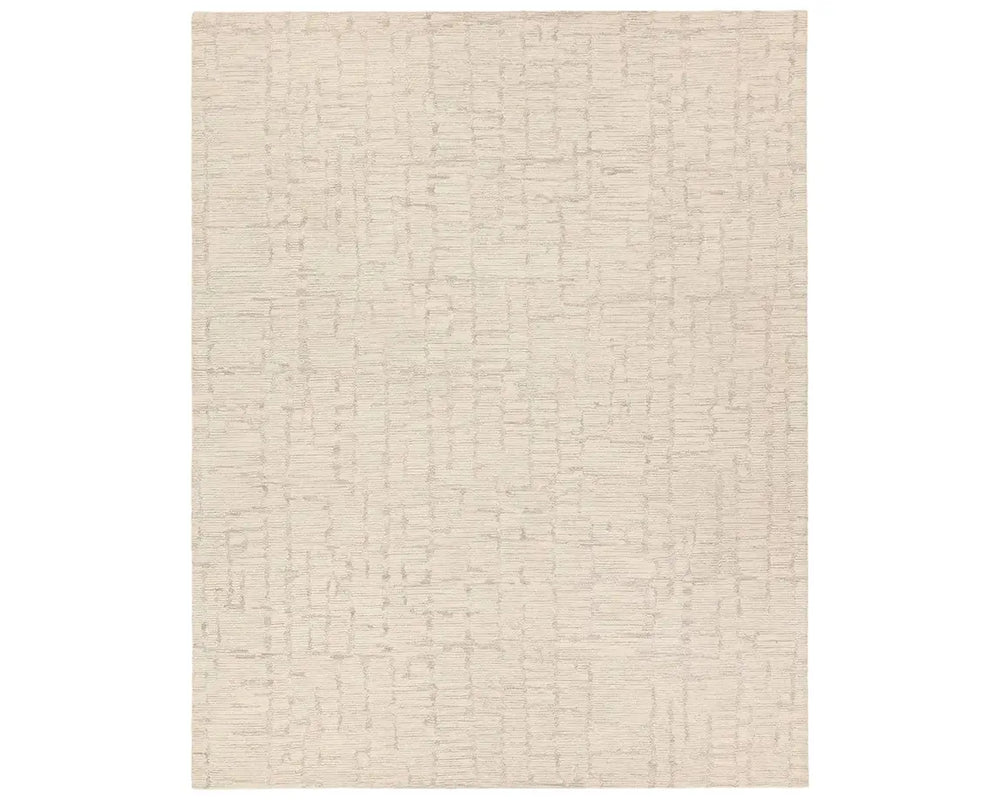 Light beige wool area rug with a hand-tufted texture