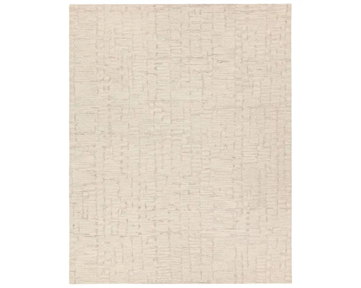 Light beige wool area rug with a hand-tufted texture
